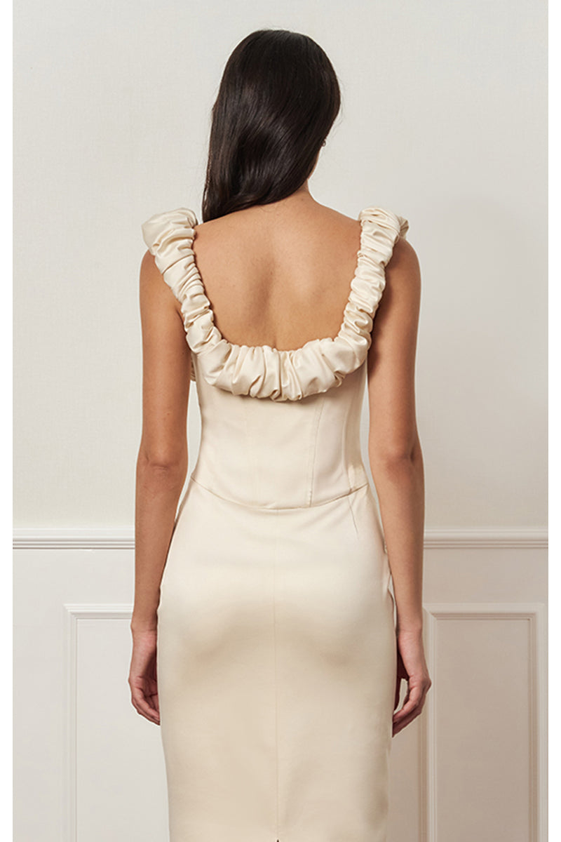 Beige croissant corset maxi dress by Stolen Stores, featuring a fitted bodice and flowing skirt, stylish and elegant for special occasions.