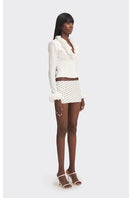 White croissant-shaped corset shirt by Stolen Stores, featuring a fitted, stylish top with unique croissant-inspired design.