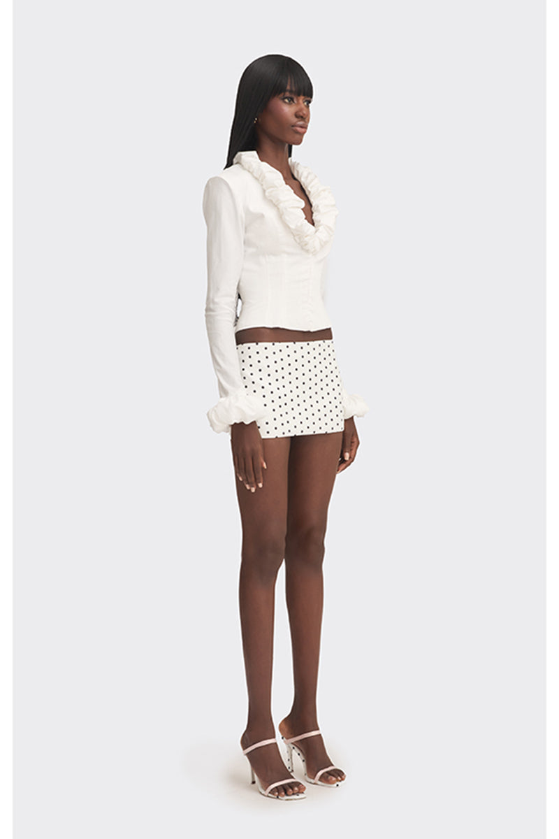 White croissant-shaped corset shirt by Stolen Stores, featuring a fitted, stylish top with unique croissant-inspired design.