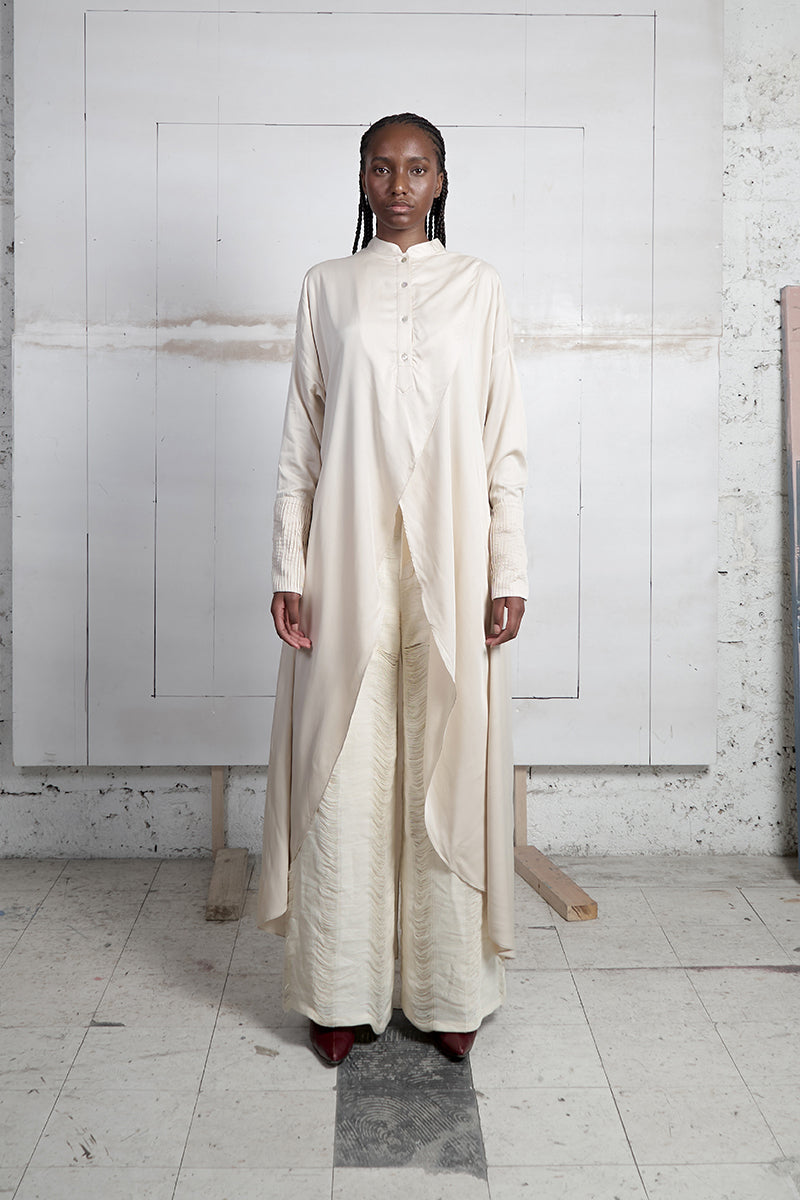 Ivory crossed layer shirt dress by MAZ Manuela Álvarez featuring a maxi length and stylish layered design.