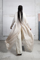 Ivory crossed layer shirt dress by MAZ Manuela Álvarez, a stylish maxi dress with layered design and button details.
