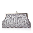 Silver crossed clutch bag by Sarah's Bag featuring sleek design and elegant craftsmanship.