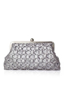 Silver crossed clutch bag by Sarah's Bag featuring sleek design and elegant craftsmanship.