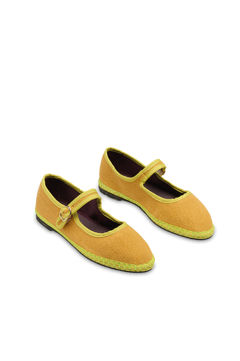 Yellow Flabelus Ebenezer flats with smooth finish and rounded toe, shown on a neutral background.