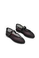 Black Flabelus Isabella flats with sleek design, featuring smooth material and comfortable slip-on style.