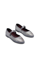 Silver Flabelus Lavinia flats with pointed toes and sleek design, shown on a model's feet.