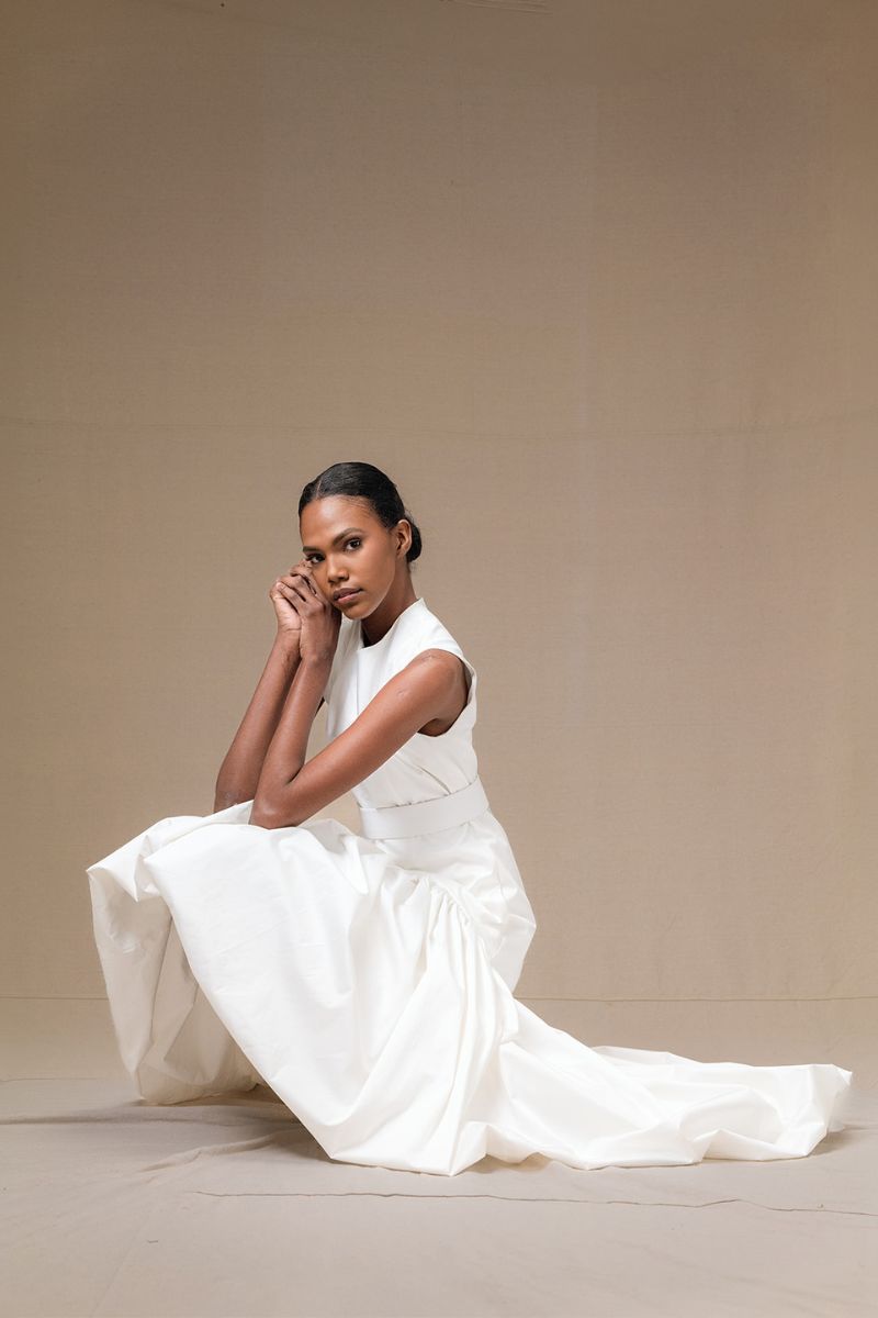 Ivory Cupula dress by Ana + Maria, a stylish maxi dress with dark salmon accents, showcased on a model.
