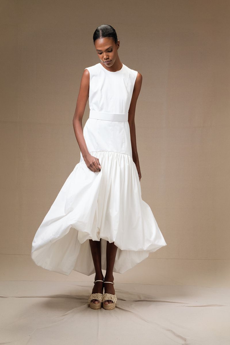 Ivory Cupula Dress by ANA + MARIA, a flowy maxi dress featuring elegant design and lightweight fabric, shown on a model.