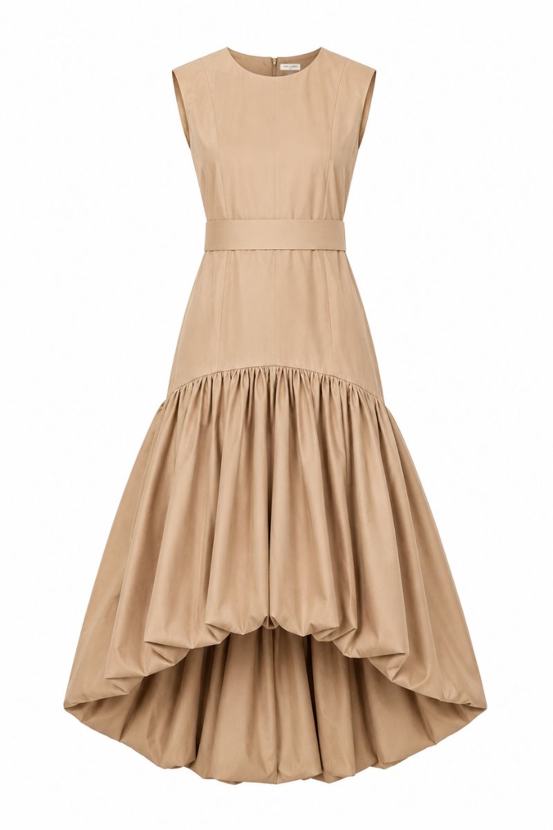 Tan Cupula Maxi Dress by ANA + MARIA displayed on a ghost mannequin, showcasing its flowing fabric and elegant design.