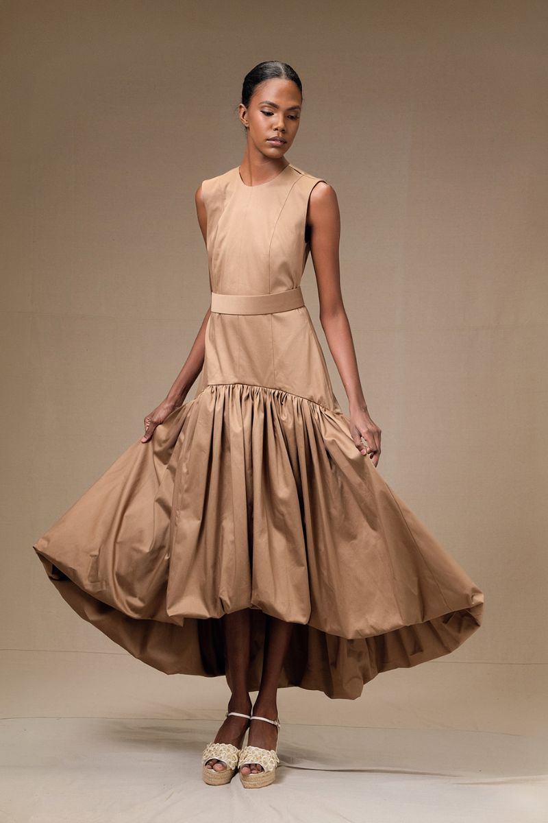 Tan Cupula dress by ANA + MARIA, a stylish maxi dress with a flowing design and sleeveless silhouette.