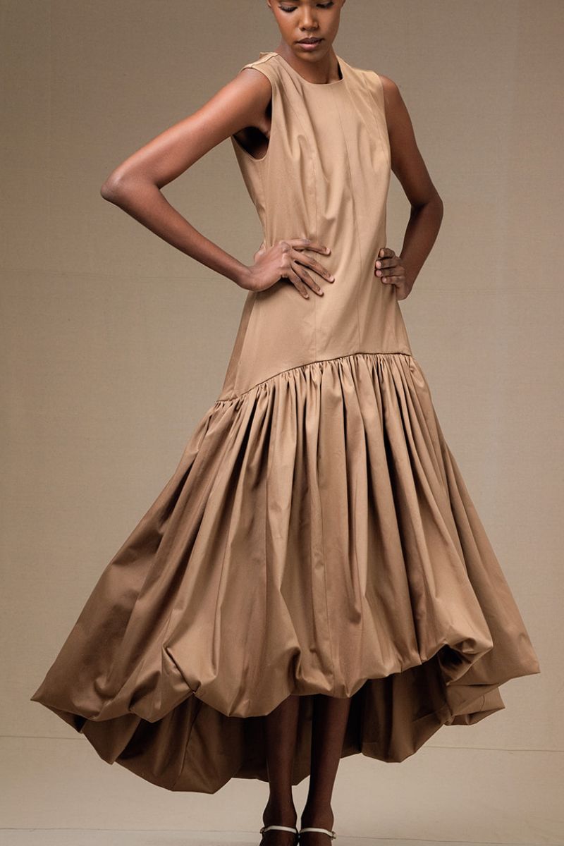 Tan Cupula Dress by ANA + MARIA, a stylish maxi dress with flowing fabric and elegant design, perfect for casual or formal occasions.