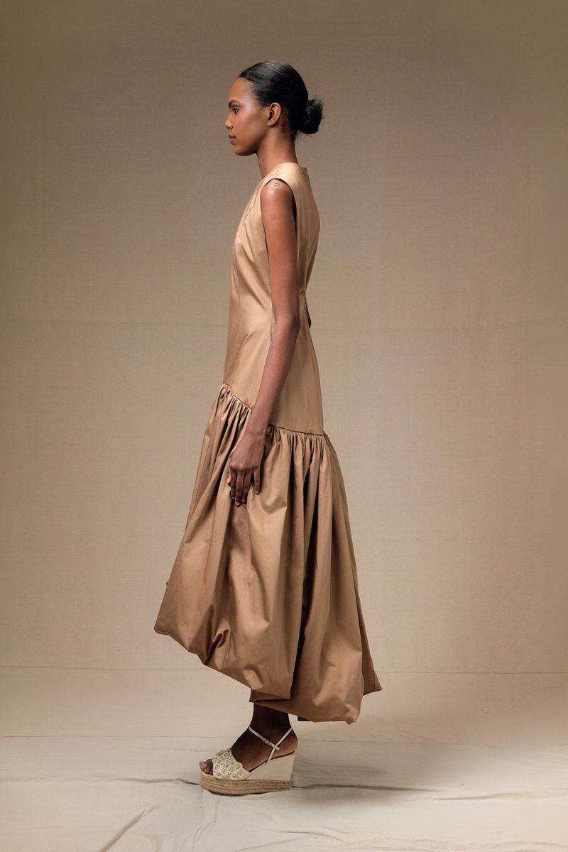 Tan Cupula dress by ANA + MARIA, a stylish maxi dress with a flowing silhouette and elegant design.