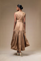 Tan Cupula dress by ANA + MARIA, a stylish maxi dress with a flowing silhouette and elegant design, shown in a web photo.