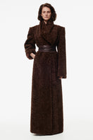 Chocolate brown Kris Marán curly maxi coat with textured, voluminous fabric and wide lapels, styled for a cozy, elegant look.