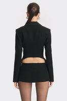 Black open back suit jacket from Stolen Stores' Curve collection, featuring a tailored fit and stylish design.