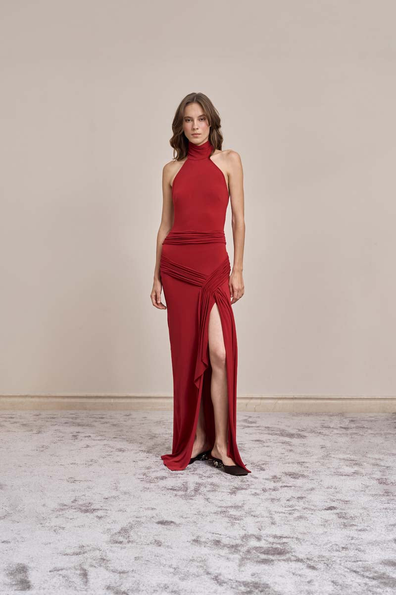 Red YASSMIN SALEH Curve Gown maxi dress shown from the front, featuring a flowing silhouette and elegant design.
