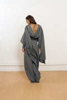 YASSMIN SALEH Curve wool pants in gray viewed from the back, showcasing tailored fit and soft wool fabric.