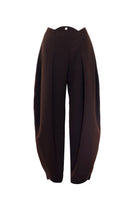 YASSMIN SALEH curve crepe pants in brown, showing a close-up of the stylish, fitted design and textured fabric.