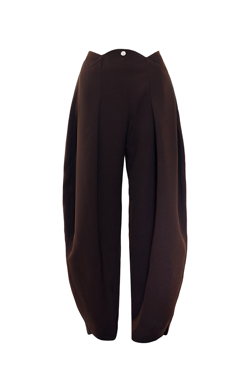 YASSMIN SALEH curve crepe pants in brown, showing a close-up of the stylish, fitted design and textured fabric.
