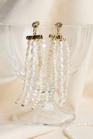 LAVANI JEWELS Cyra Fringe Earrings with gold-tone fringe design hanging from elegant earring hooks.