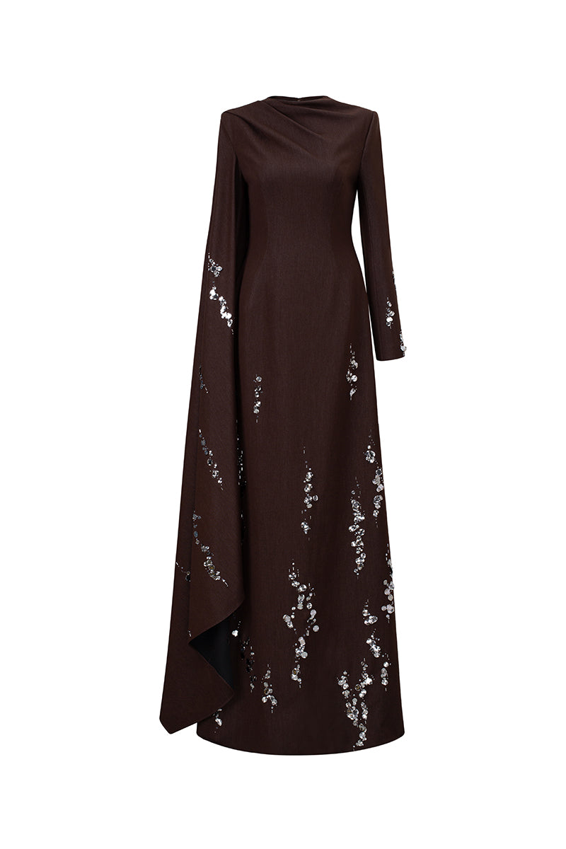 Elegant deep tone embroidered gown by GVLUX featuring intricate embroidery and flowing fabric, perfect for formal occasions.