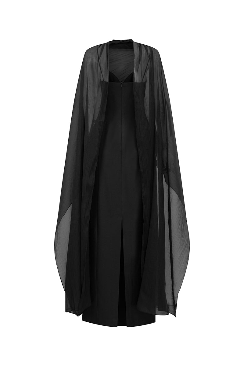 Black cape neck column gown by GVLUX, featuring sleek fabric and elegant design, shown on a hanger.