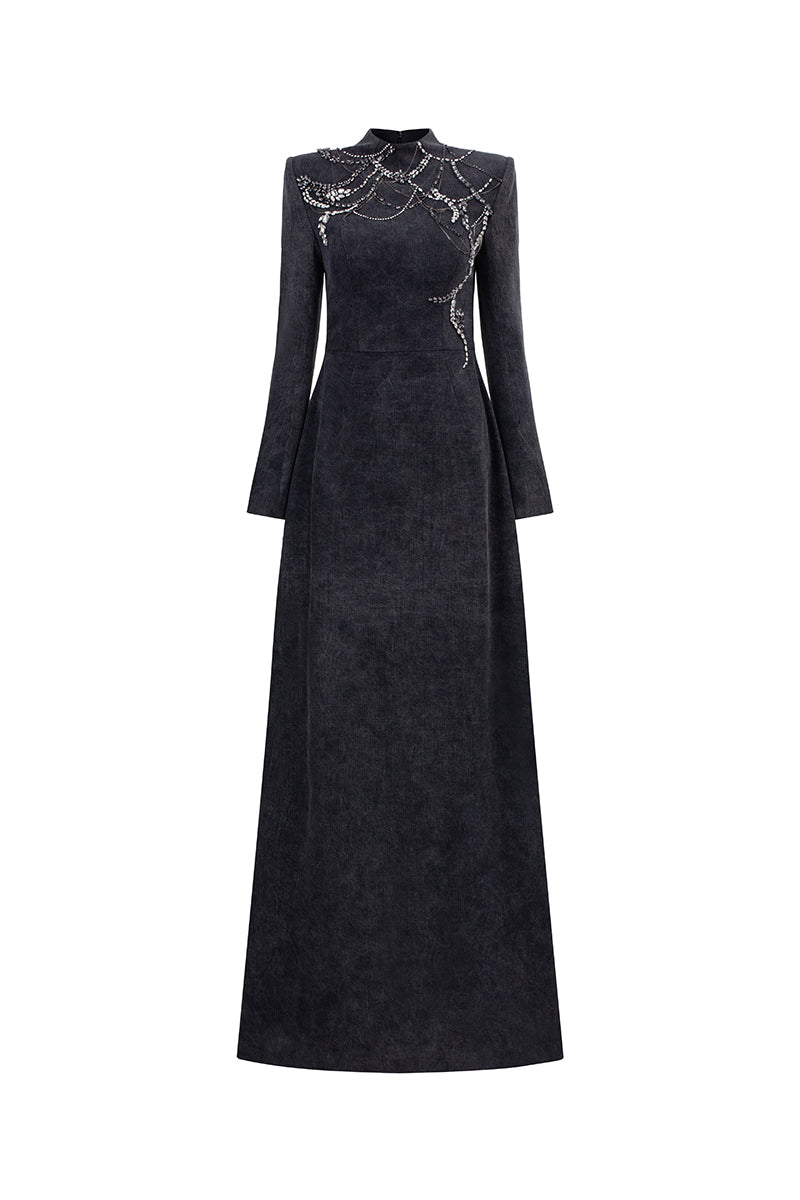 Elegant midnight firework-themed long sleeve gown by GVLUX featuring intricate design and flowing fabric for formal occasions.