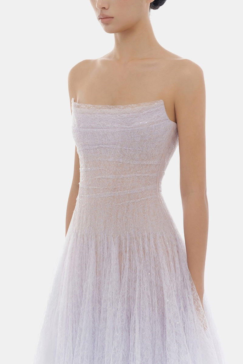 Elegant violet lace maxi dress by Montsand featuring draped fabric and intricate lace details, perfect for formal occasions.