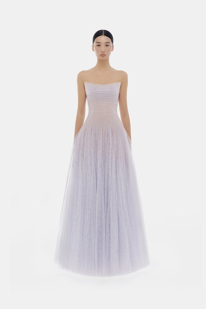 Elegant violet lace maxi dress with draped design by Montsand, featuring intricate lace details and flowing silhouette.