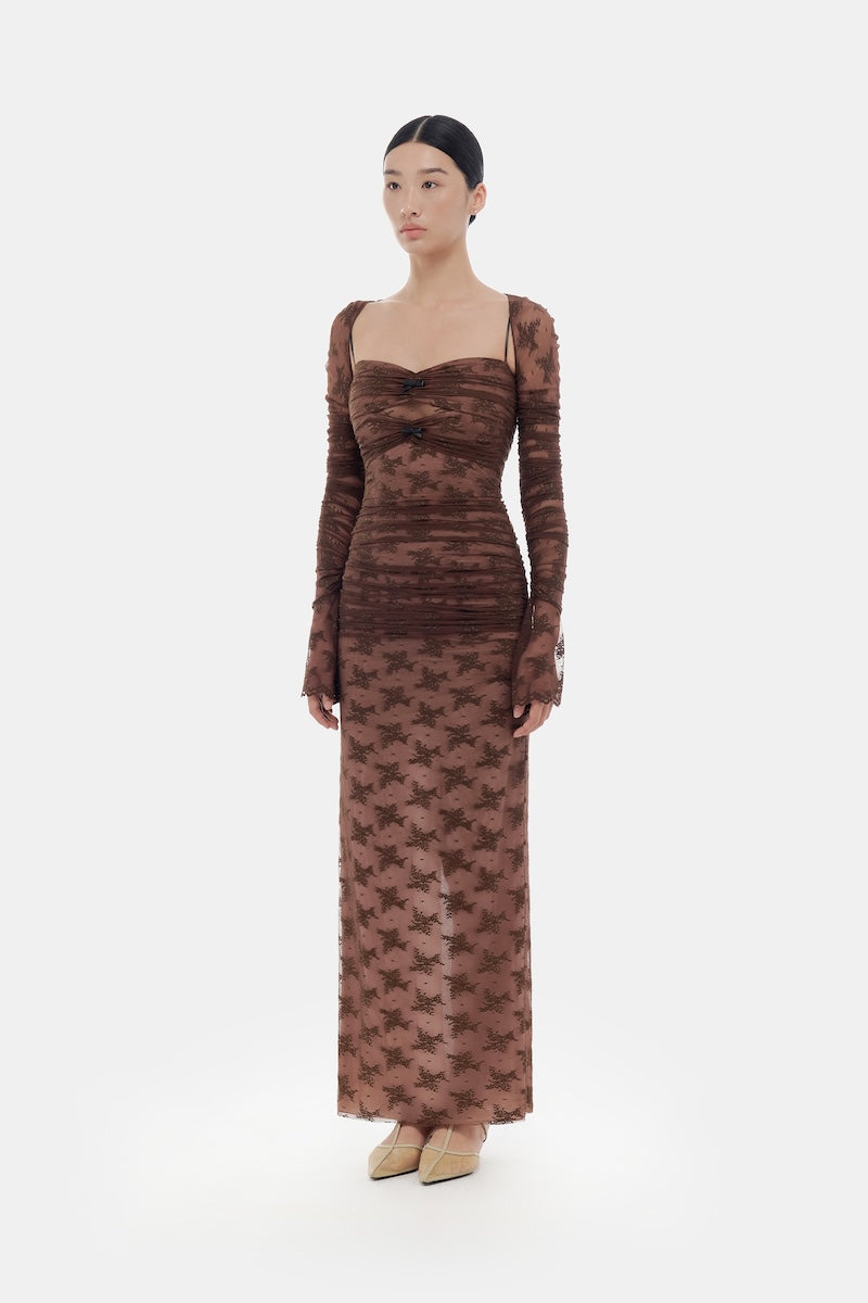 Brown bow cut-out lace maxi dress by Montsand featuring a flowing silhouette and intricate lace details.