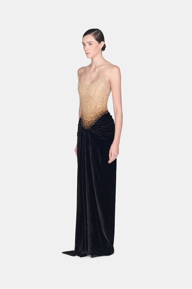 Black Champagne crystalized gown by Montsand, featuring intricate crystal embellishments and elegant flowing fabric.