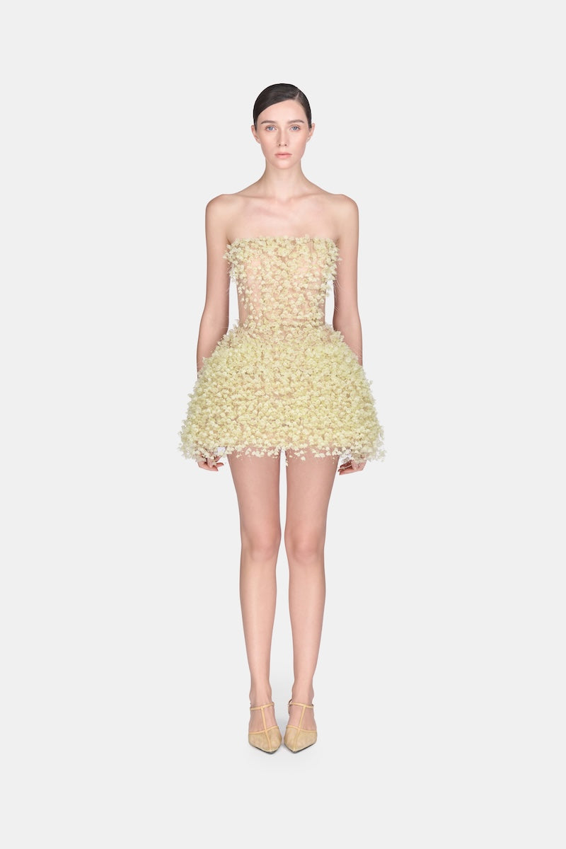 Montsand Lime Flowers mini dress with a vibrant floral pattern, sleeveless design, and lightweight fabric for a stylish summer look.