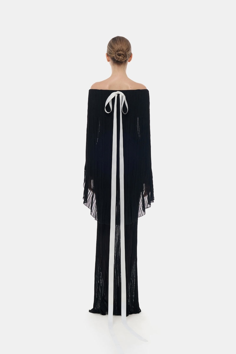 Black off-shoulder pleated maxi dress by Montsand, flowing gown with elegant pleats and a stylish off-shoulder neckline.