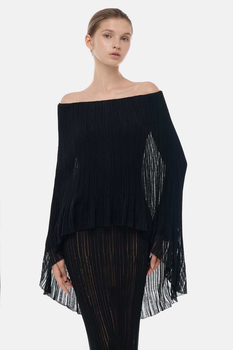 Black off-shoulder pleated maxi gown by Montsand, flowing fabric with elegant pleats, perfect for formal occasions.