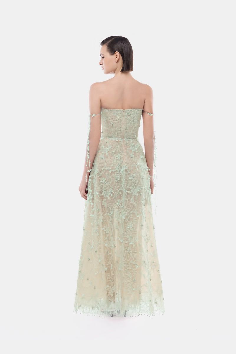 Montsand mint floral string maxi dress displayed on a hanger, featuring a flowing gown with floral print and adjustable straps.