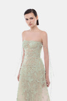 Mint floral string maxi dress by Montsand, flowing gown with delicate floral pattern and adjustable straps, perfect for summer occasions.
