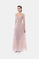 Violet floral string maxi gown by Montsand featuring a flowing design and elegant floral pattern.