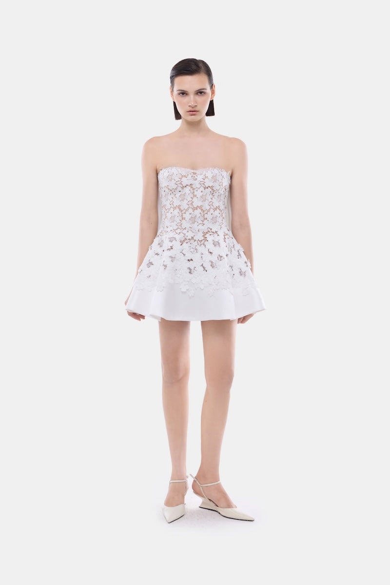 White detachable cape skater dress by Montsand, featuring a fitted mini dress with stylish cape detail, perfect for trendy occasions.