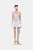 White detachable cape skater dress by Montsand, featuring a fitted mini dress with stylish cape detail, perfect for trendy occasions.