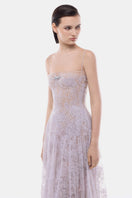 Elegant violet pleated gown with a straight neckline by Montsand, showcased on a model in a full-length view.
