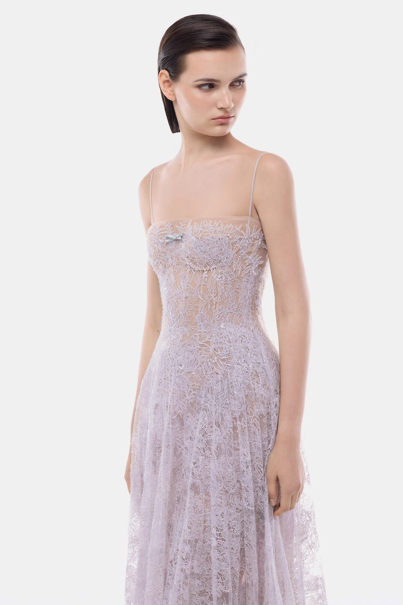 Elegant violet pleated gown with a straight neckline by Montsand, showcased on a model in a full-length view.