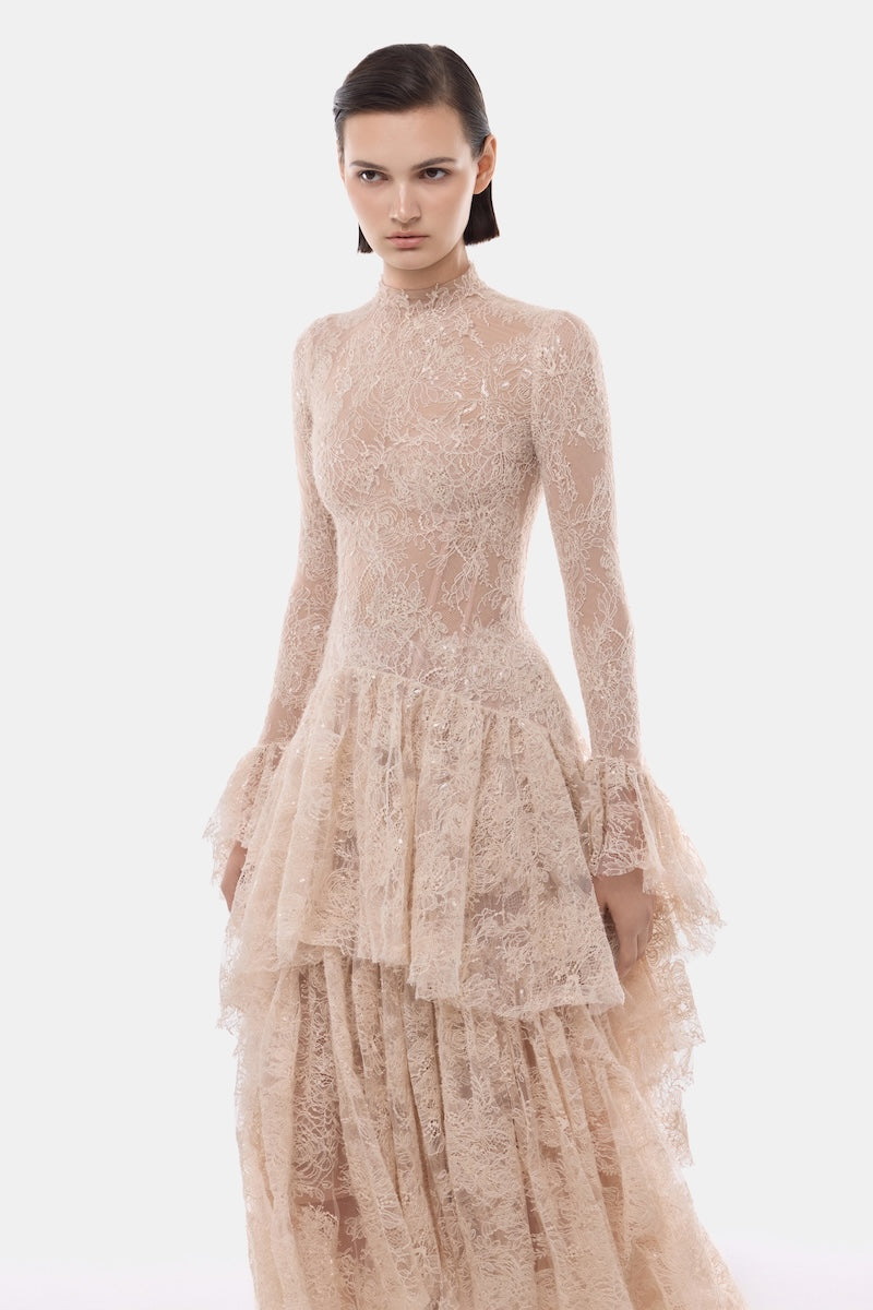 Elegant peach lace mullet gown by Montsand, featuring intricate lace details and a flowing hem for formal occasions.