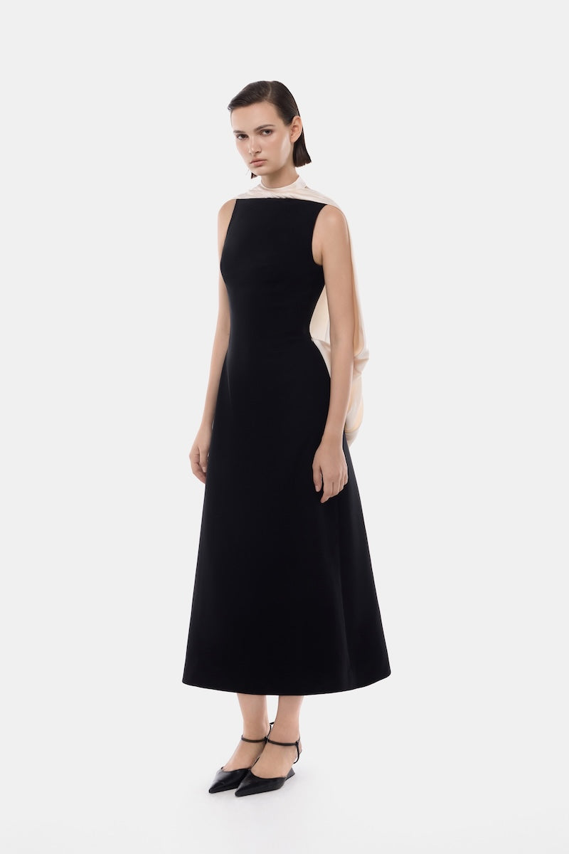 Black mock neck midi dress by Montsand featuring a stylish, fitted silhouette and elegant design.