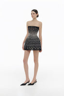 Black silver bow strapless mini dress by Montsand, featuring a fitted silhouette and stylish bow detail at the bust.