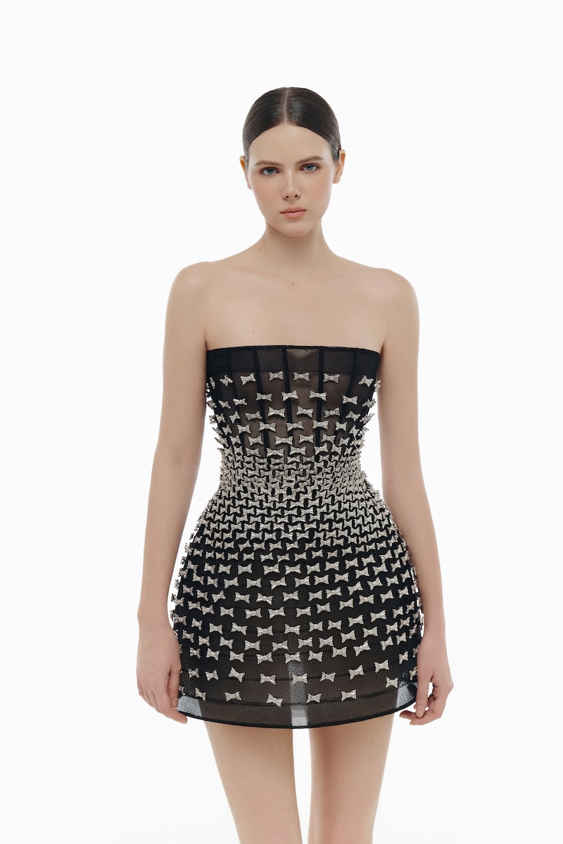 Black silver bow strapless mini dress by Montsand, featuring a fitted silhouette and stylish bow detail at the bust.