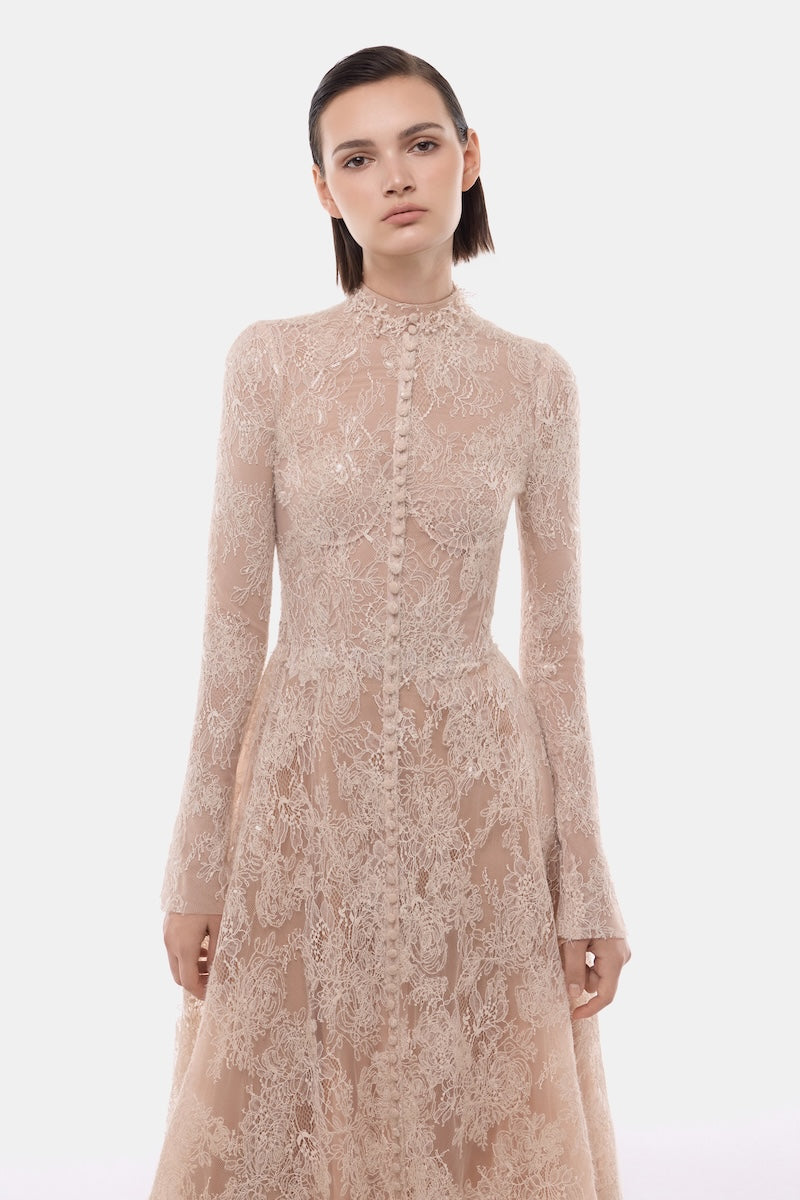 Peach lace button-front gown by Montsand, elegant evening dress with delicate lace details and fitted silhouette.