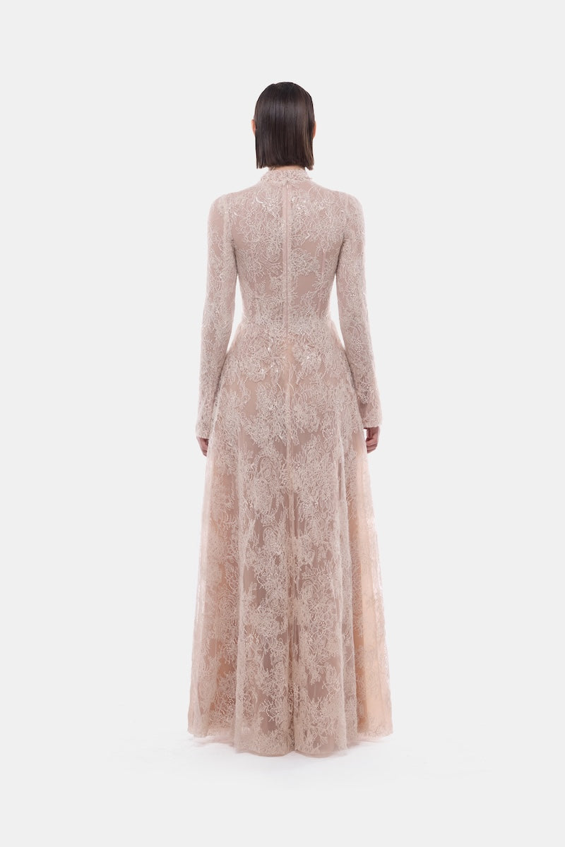 Peach lace gown with button front from Montsand, featuring a flowing design and elegant details for formal occasions.