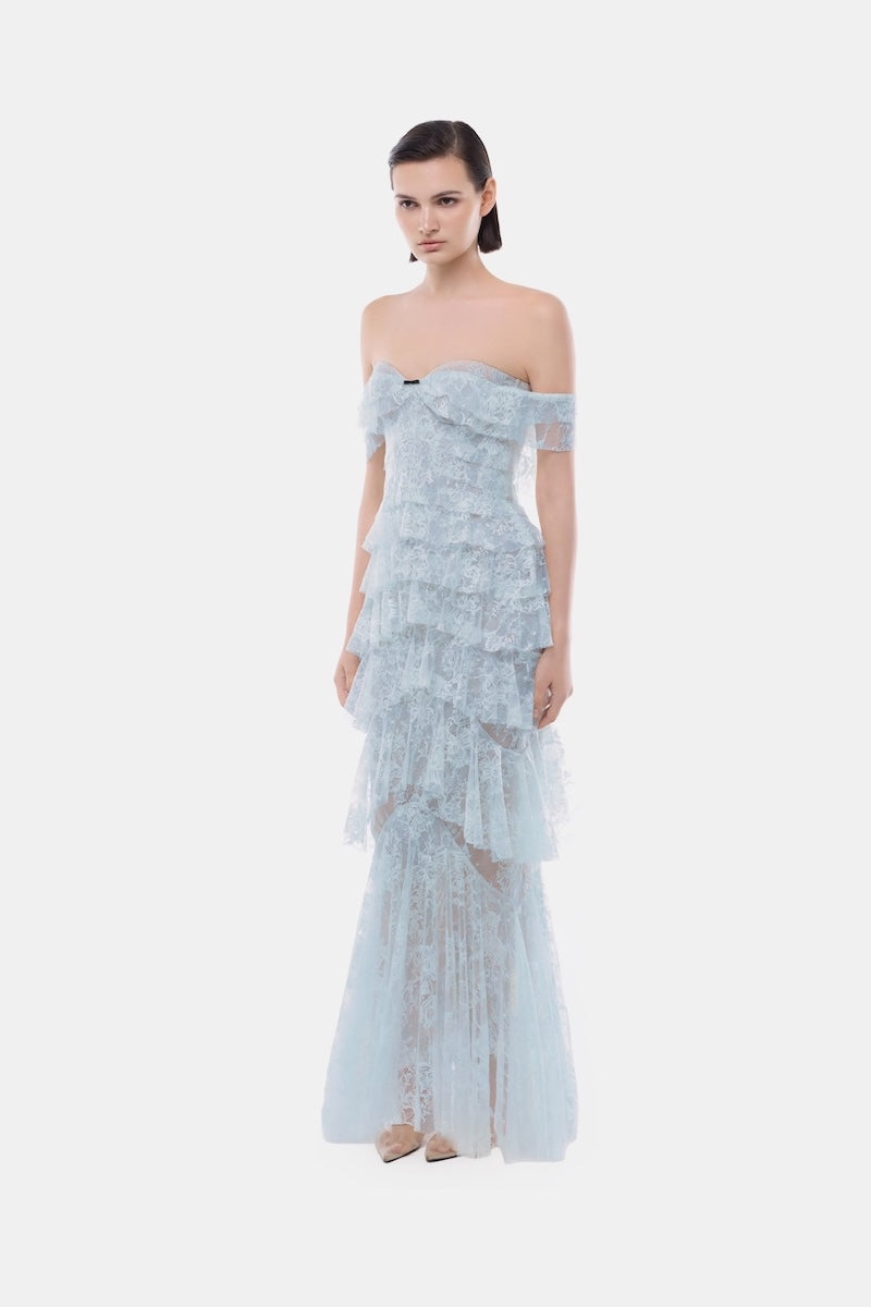 Blue lace ruffle strap off-shoulder gown by Montsand with delicate lace details and flowing ruffle accents.