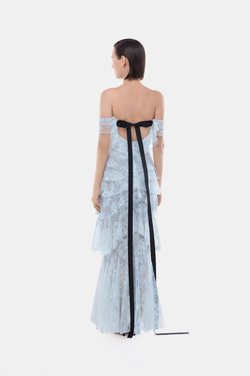 Blue lace ruffle strap-off gown by Montsand featuring elegant lace details and flowing silhouette.