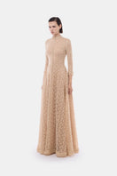 Elegant gold leaf button-front gown by Montsand, featuring a flowing design and intricate detailing perfect for formal occasions.